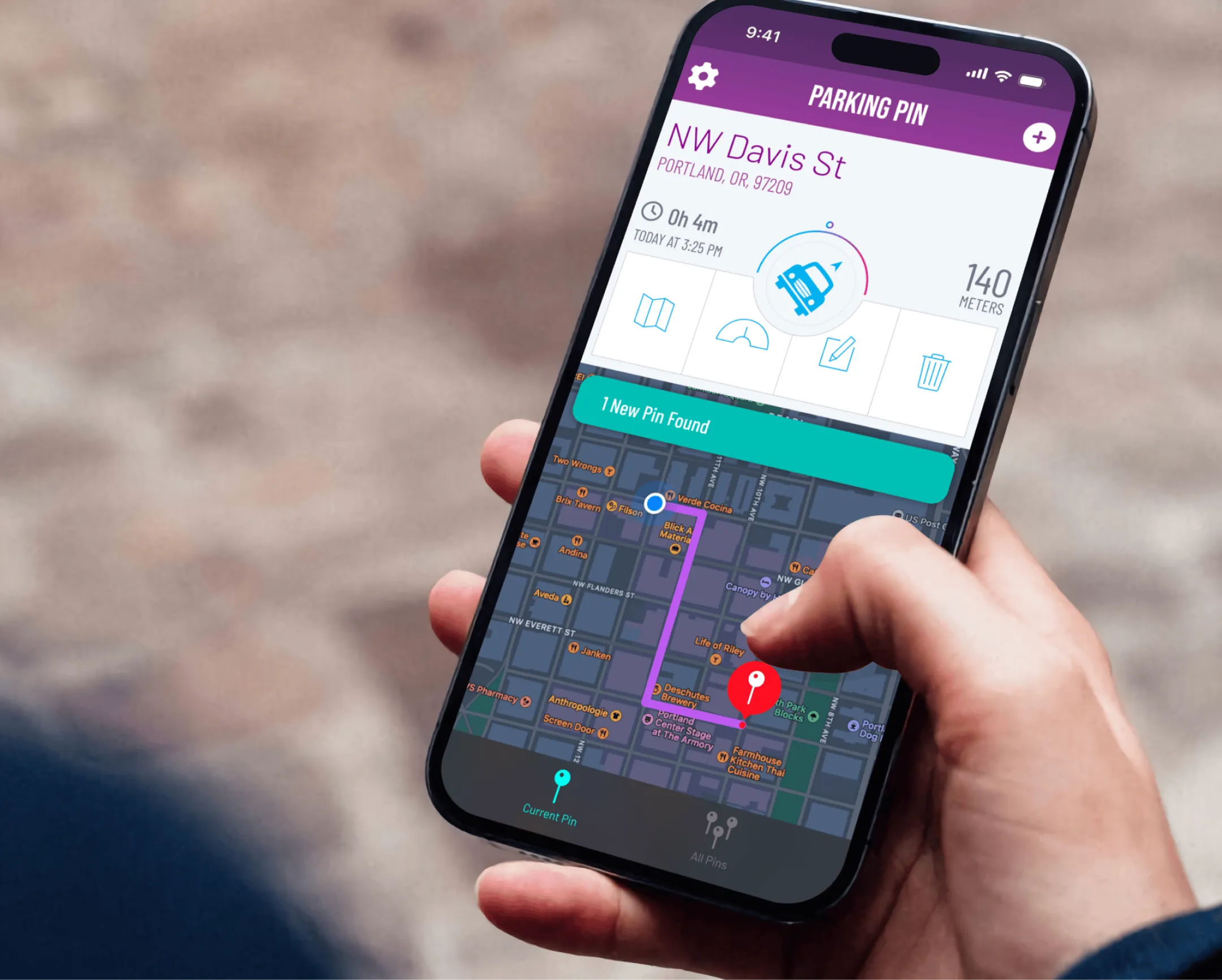 A person holding a phone to find their car showing the home screen of the Parking Pin iOS App produced by Everyday Odyssey